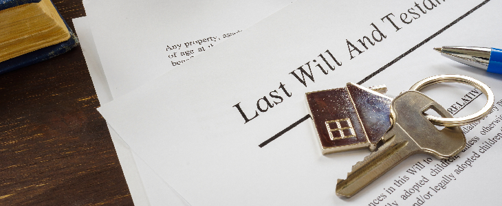 last will and testament documents with keys and a pen in front of it