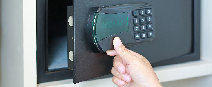 person hand opening up a safe to preserve and store documents