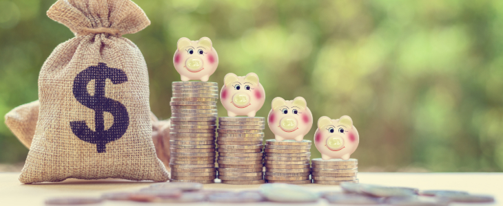 image of stacked coins with little piggy banks on top of them